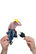 Electrician sitting on a plug