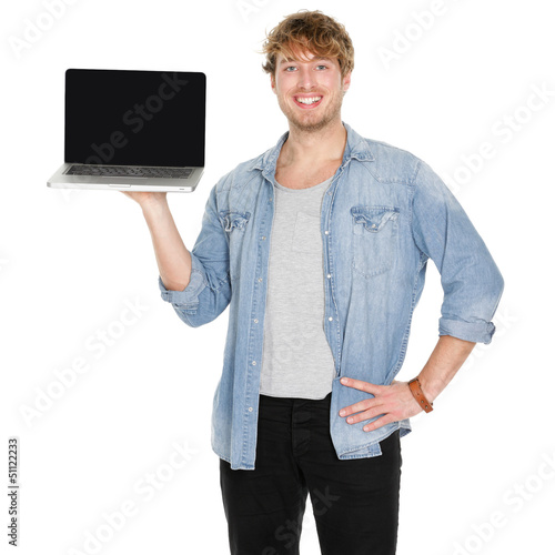 Photo: Young man student showing blank laptop screen Young man student showing blank laptop screen