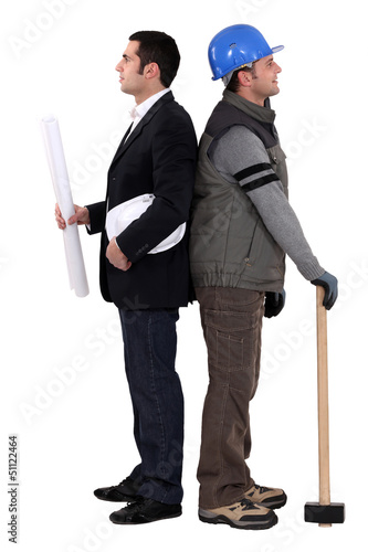 Photo: Architect and construction worker standing back to back Architect and construction worker standing back to back