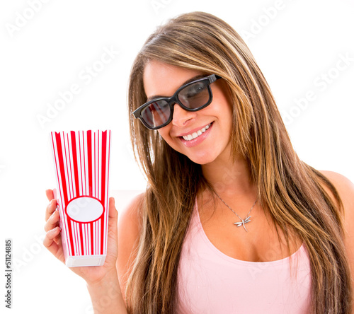 Photo: Woman eating popcorn at the movies Woman eating popcorn at the movies