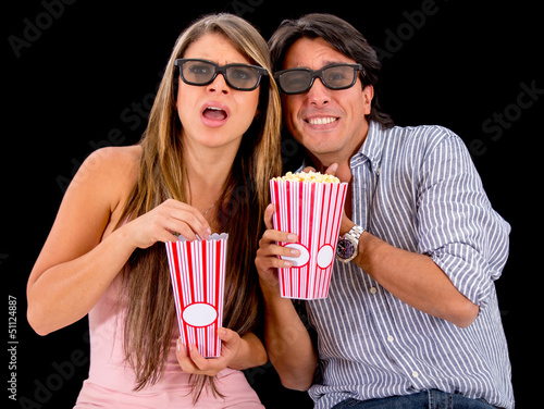 Photo: Couple watching a 3D movie Couple watching a 3D movie