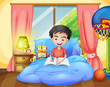 A boy writing on his bed