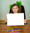 Schoolgirl artist with white blank paper sheet