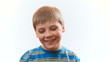 The boy laughs. Joyful happy child.
