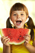 girl with a piece of watermelon