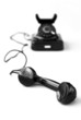 Vintage black telephone on white