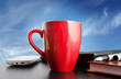 coffee on a black table over blue sky background