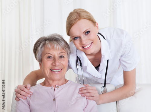 Photo: Portrait Of Doctor And Patient Sitting On Couch Portrait Of Doctor And Patient Sitting On Couch