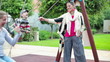 Happy girlfriends on playground with son, steadicam shot