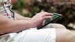 Close up of male hands using tablet computer, steadicam shot