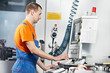 Foto: industrial worker at tool workshop industrial worker at tool workshop