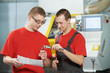 industrial workers at tool workshop