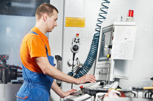 Photo: industrial worker at tool workshop industrial worker at tool workshop