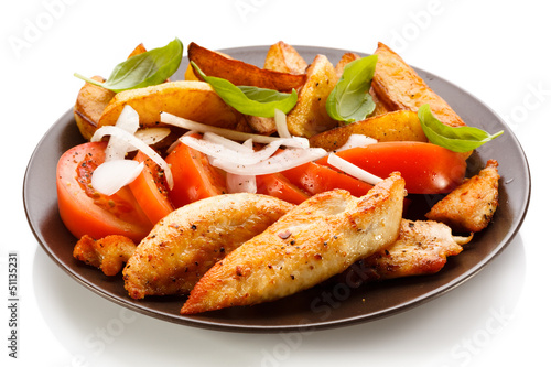 Photo: Grilled chicken breasts with cheese and baked potatoes Grilled chicken breasts with cheese and baked potatoes