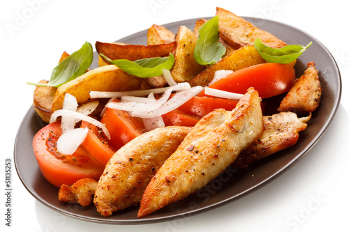 Photo: Grilled chicken breasts with cheese and baked potatoes Grilled chicken breasts with cheese and baked potatoes