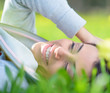 Foto: Young Woman Lying On Grass Young Woman Lying On Grass