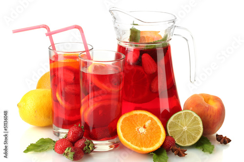 Photo: sangria in jar and glasses with fruits, isolated on white sangria in jar and glasses with fruits, isolated on white