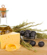 Black olives in white bowl with rosemary,olive oil and cheese