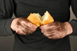 homeless man holding a white bread, close-up
