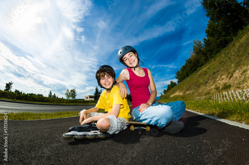 Photo: Active young people - rollerblading, skateboarding Active young people - rollerblading, skateboarding