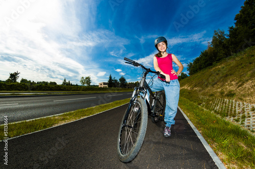 Photo: Healthy lifestyle - girl biking Healthy lifestyle - girl biking