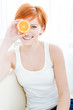 Beautiful girl with juicy orange