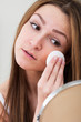 Woman Cleansing Her Face