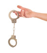 Close-up Hand Holding Handcuffs
