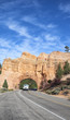 Truck under the rock
