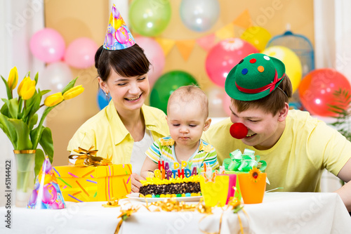 Photo: family celebrating first birthday of baby girl family celebrating first birthday of baby girl