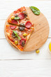 two slice of pizza with salami and mozzarella
