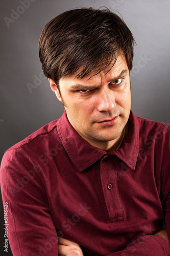 Photo: Young man with serious expression Young man with serious expression