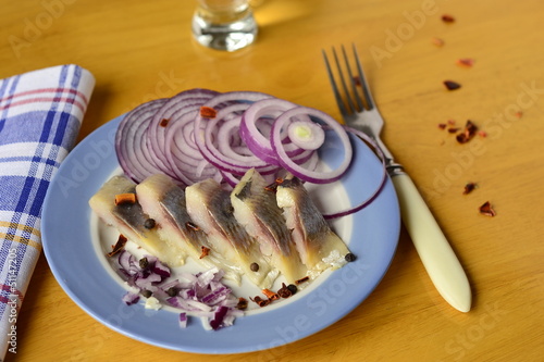 Photo: Portion herring fillet with onions and peppers Portion herring fillet with onions and peppers