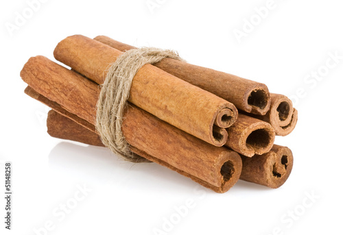 Photo: cinnamon sticks on white cinnamon sticks on white