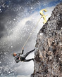 busiessman climbing mountain
