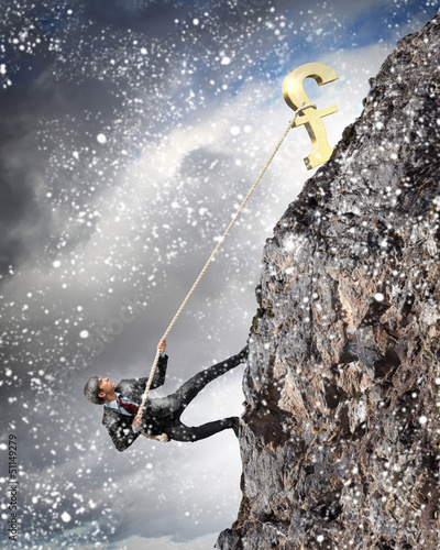 Photo: busiessman climbing mountain busiessman climbing mountain