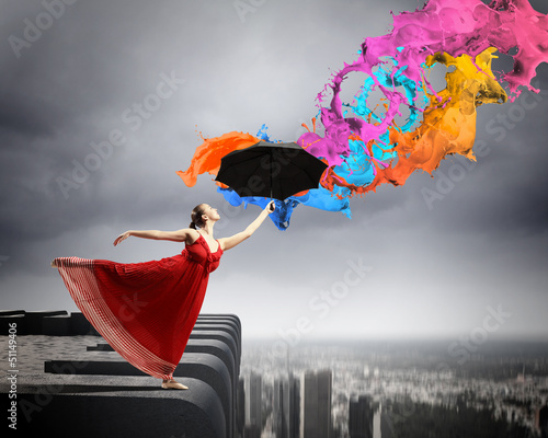 Photo: Ballet dancer in flying satin dress with umbrella Ballet dancer in flying satin dress with umbrella