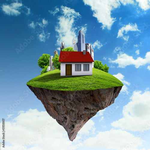 Photo: A piece of land in the air with house and tree. A piece of land in the air with house and tree.
