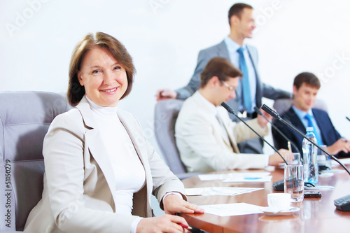 Photo: Four businesspeople at meeting Four businesspeople at meeting