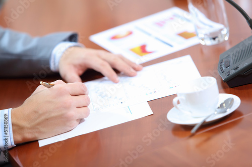 Photo: Hands of businessman writing Hands of businessman writing