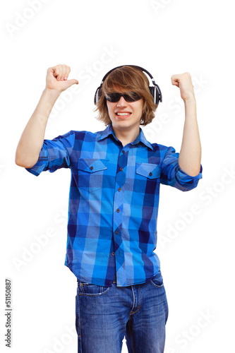 Photo: Happy smiling young man dancing Happy smiling young man dancing