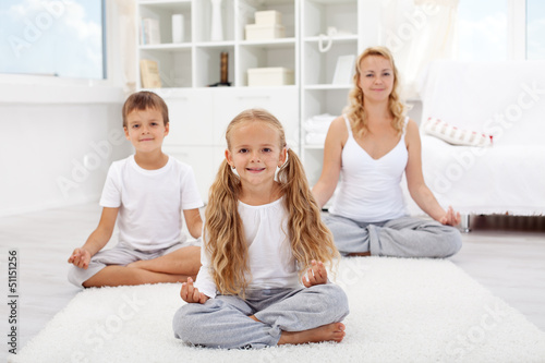 Photo: Kids doing yoga relaxing exercise Kids doing yoga relaxing exercise