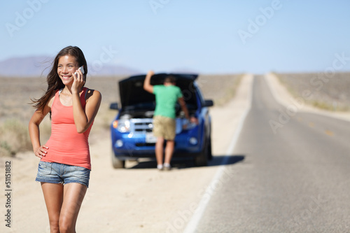 Photo: Car breakdown - woman phone calling auto service Car breakdown - woman phone calling auto service