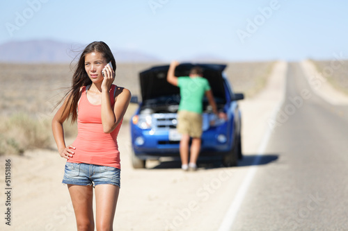 Photo: Car breakdown - woman calling auto service help Car breakdown - woman calling auto service help