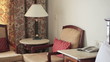 The lamp shade and chairs in a hotel room