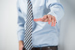 Young unrecognizable business man touching virtual button. Edita