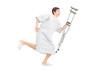 Full length portrait of a male patient running and holding a cru