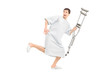 Full length portrait of a male scared patient running and holdin