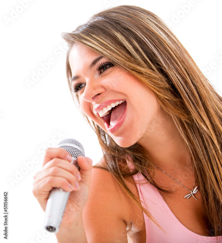 Photo: Woman singing with a microphone Woman singing with a microphone