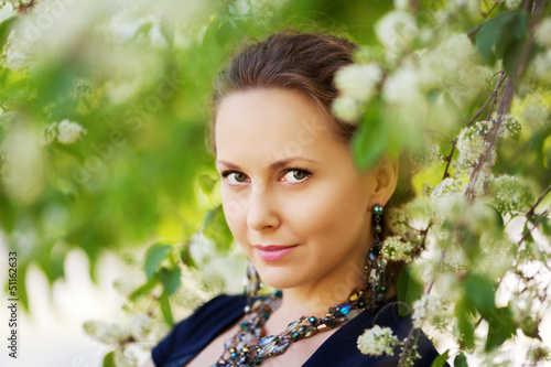 Photo: Beautiful woman in a spring garden Beautiful woman in a spring garden